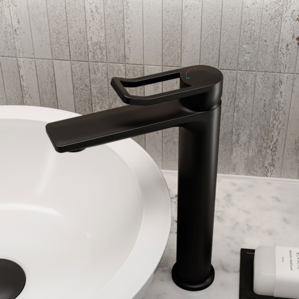 Lifestyle image of the Bristan Saffron Black Tall Basin Mixer Tap & Click-Clack Waste mounted next to a round countertop basin